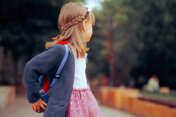 istock Little Girl Wearing a Backpack Going back to School 1544205682