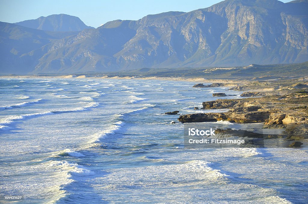 Coastal Scene, Western Cape, South Africa Waves crash along the rocky shore near Hermanus, Western Cape, South Africa. Hermanus is the Whale watching capital of South Africa Africa Stock Photo