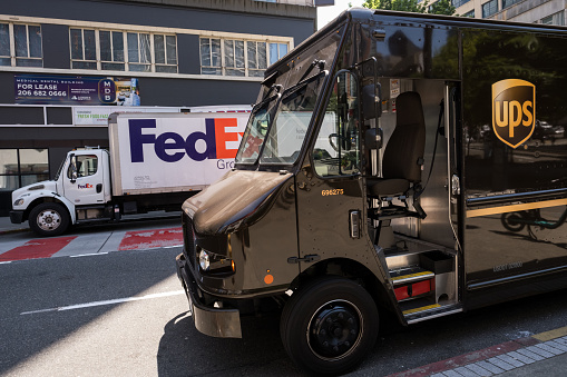 Seattle, USA- Jul 5, 2023: FedEx and UPS in Westlake late in the day.