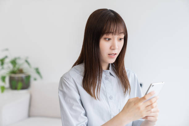 istock attractive Asian woman using a smart phone 1544274442
