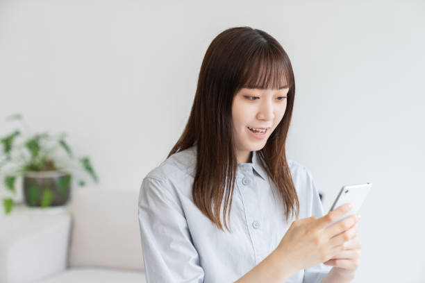 istock attractive Asian woman using a smart phone 1544275460