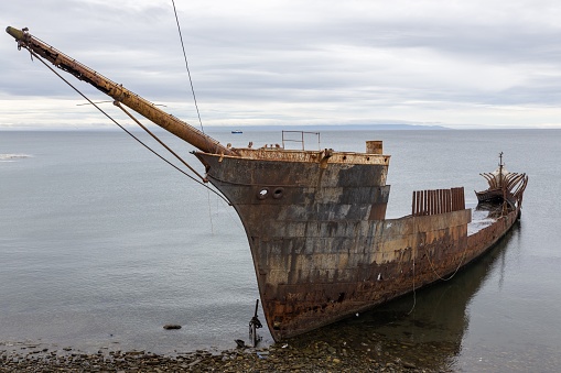 A shipwreck in the sea at the Strait of Magellan near Punta Arenas between Atlantic and Pacific Ocean, Chile, Patagonia, South America