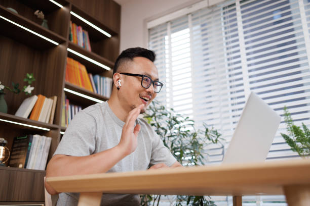 istock middle-aged man workers work with laptops in their living room at home 1544334370