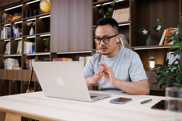 istock Middle-aged male white-collar workers use laptops for video conferencing at home 1544334887