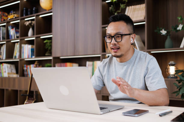 istock male white-collar workers use laptops for video conferencing at home 1544334891