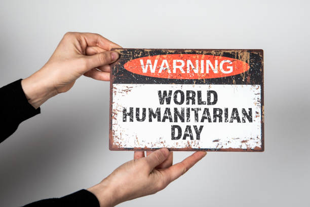 istock World Humanitarian Day 19 August. Warning sign with text on a white background 1544386254
