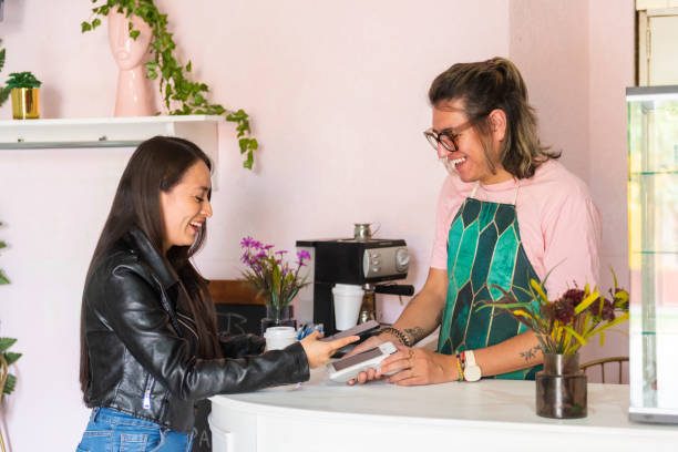 istock Woman when paying with cellphone 1544402666