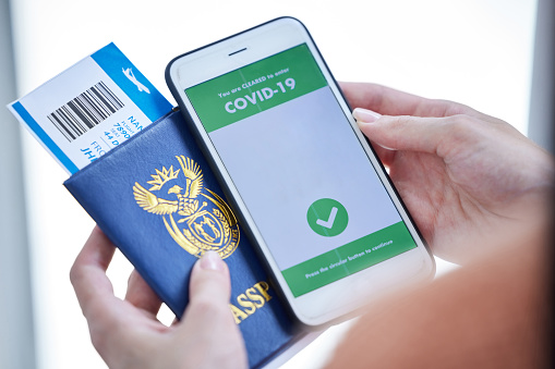 Passport, travel and covid vaccine phone barcode of hands holding documents for immigration. Plane ticket, digital airplane pass and identity document for a holiday, vacation or international trip