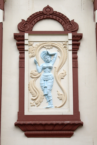 Image of an Indian goddess, on the wall of a temple, Singapore.