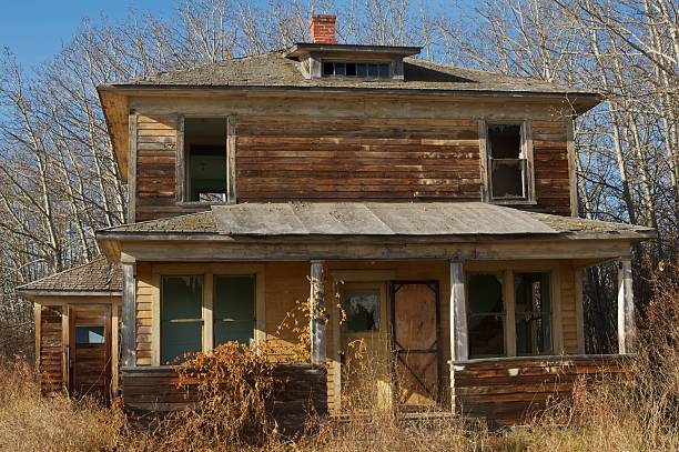 istock old abandoned farmhouse: close view of front 154451516