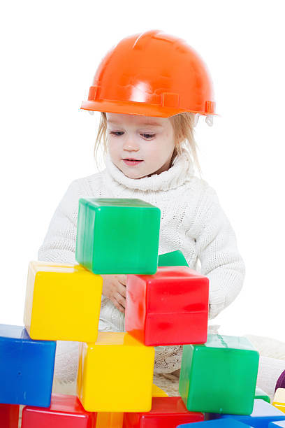 istock Baby girl plays with toy blocks 154451886