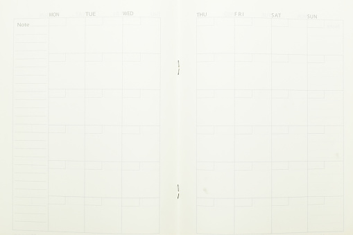 top view image of open planner notebook with blank page, paper texture background