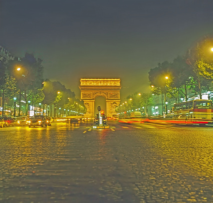 L'Arc de Triomphe at night in Paris, France