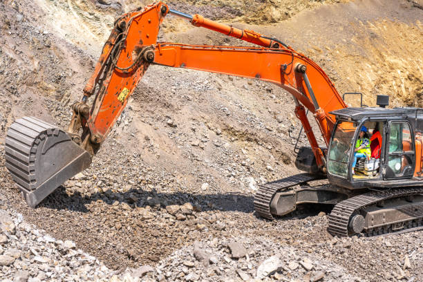 istock female construction worker Operating With Excavator 1544904421