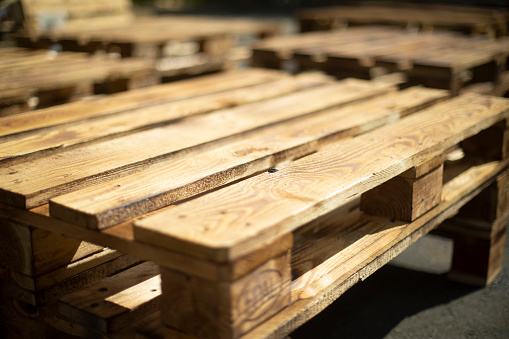 Wooden pallets. Made of planks. Craft furniture. Raw board.