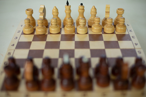 Chess on table. Strategy game. Chess pieces on board for game. Details of sports tournament.