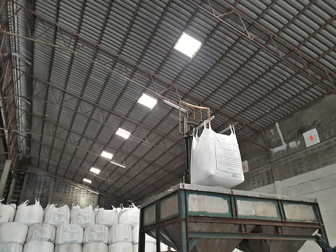 Chemical fertilizer Urea Stock pile jumbo-bag in a warehouse waiting for shipment.