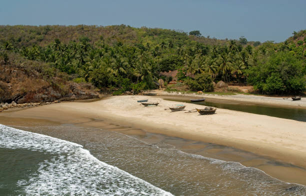 istock Fishing boats parked on sandy beach 1544975434