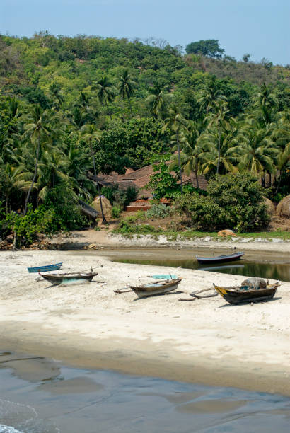 istock Fishing boats parked on sandy beach 1544976517