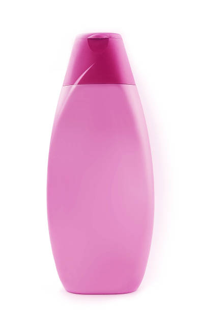 Pink shampoo bottle isolated on white