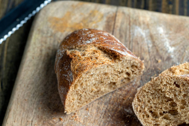 istock Dark wheat loaf of bread 1545101532