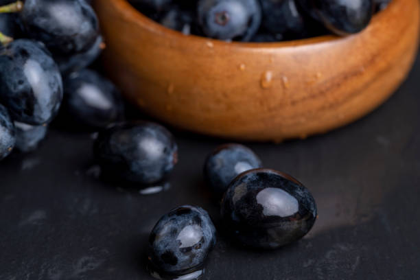 istock washed ripe black grapes covered with drops of water 1545104834