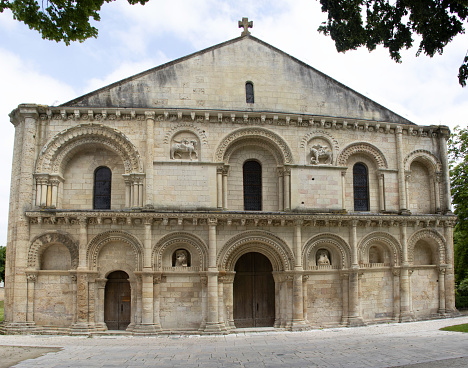 Facade and entrance door of the 11th-century Romanesque church of Notre-Dame de Surgères