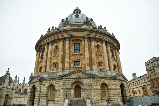 The Radcliffe Camera (from Latin camera, meaning 'room') is a building of the University of Oxford, England, designed by James Gibbs in neo-classical style and built in 1737–49 to house the Radcliffe Science Library.