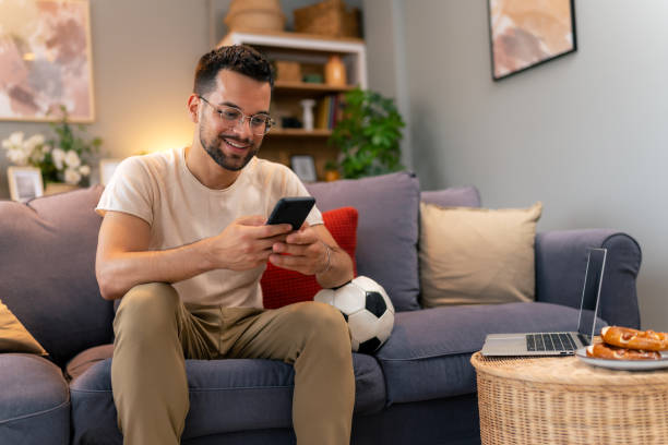 istock Man is betting online during a soccer game. 1545161984