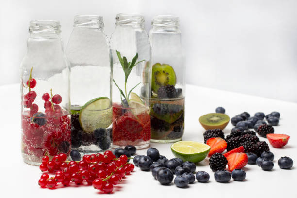 istock Red currants, strawberries, blueberries and blackberries on table. 1545165264