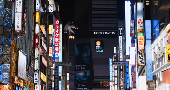 Cityscape view of Kabukicho Godzilla road, red light entertainment district in Shinjuku Tokyo. Japan tourist attraction, Japanese travel landmark, Asian people nightlife, Asia transportation city life