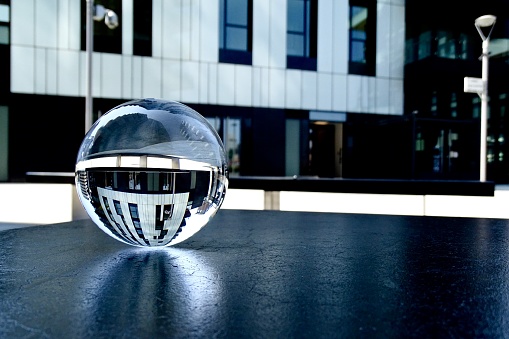 Crystal ball against modern buildings