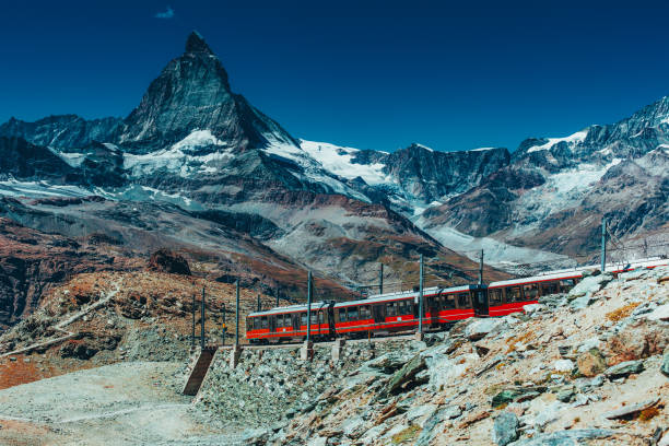 istock Train in high Alps mountains on Matterhorn background 1545298312