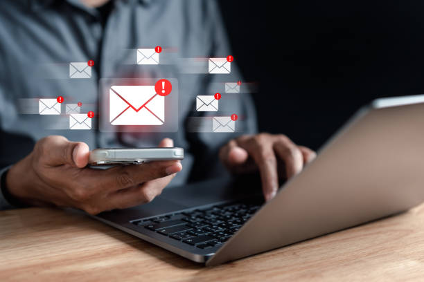 istock Alert Email inbox and spam virus with warning caution for notification on internet letter security protect, junk and trash mail and compromised information. 1545309904