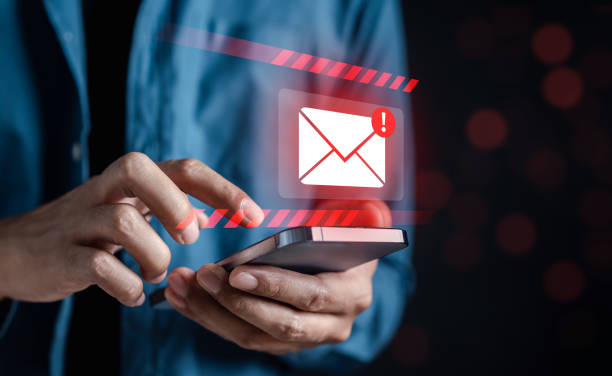 istock Alert Email inbox and spam virus with warning caution for notification on internet letter security protect, junk and trash mail and compromised information. 1545309925