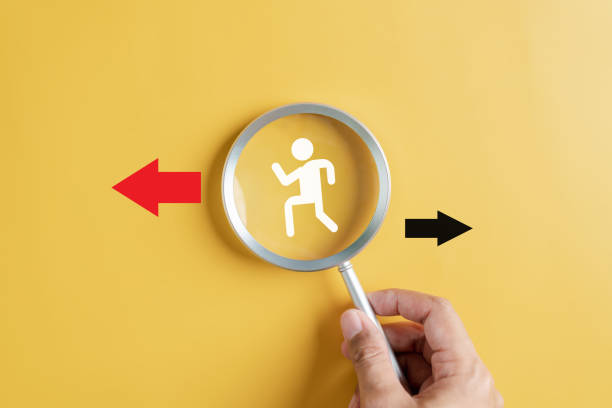 istock Businessperson following Red arrow and different direction facing opposite direction with black arrow for business disruption and technology transformation and different thinking idea concept. 1545309971