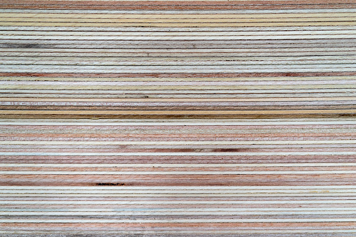 Closeup side of variety of plywood stack