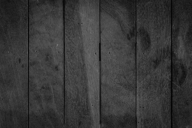 istock Old wooden board background in black and white style. 1545345342