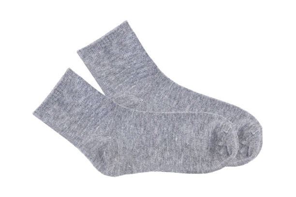 istock Gray socks isolated on white background, Clipping path Included. 1545346967