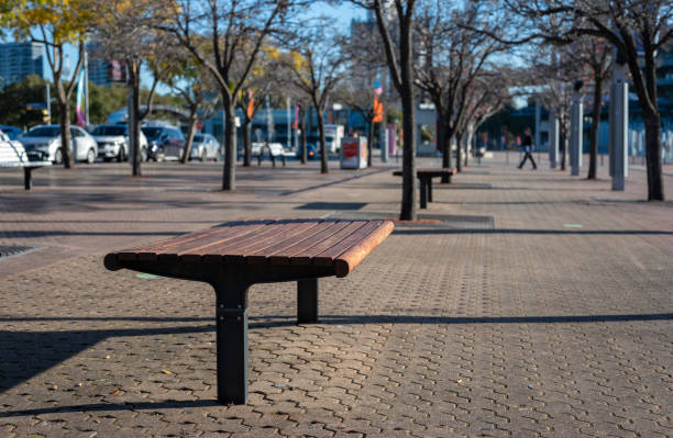 istock seats or medern bench on pavement or walking way 1545353188