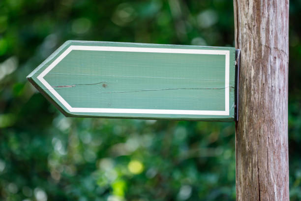 colorful wooden sign pointers - directional sign wood sign footpath imagens e fotografias de stock