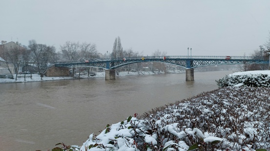 snow on the riverbank