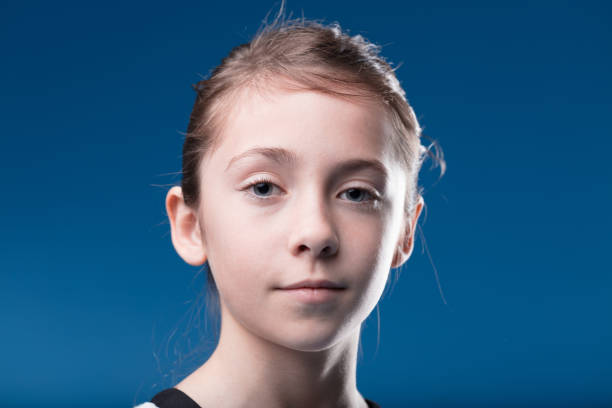 Girl in formal portrait mirrors press documents