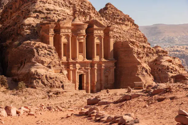 Facade of Ad-Deir Monastery in Petra Jordan. Monastery carved into sandy rocks is one of most famous sights of Petra.  Facade of Ad-Deira resembles Treasury