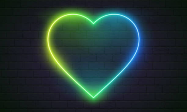 istock Neon heart. Bright night neon signboard on brick wall background with backlight. Retro glow neon heart sign. Romantic design for Happy Valentines Day. Night light advertising. Concept: valentine's day, anniversary, mother's day, marriage, invitation e-car 1545413246