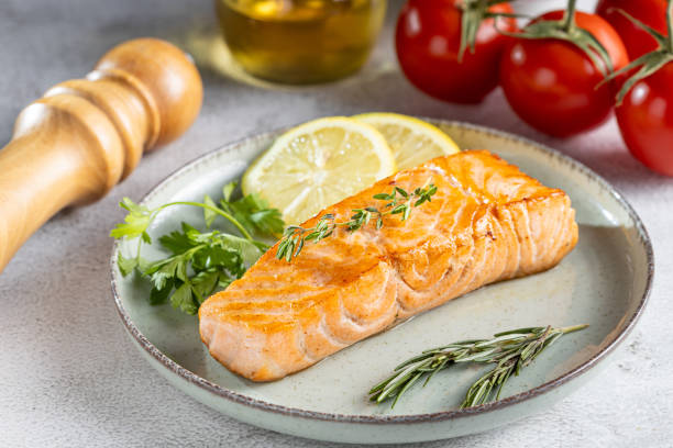 istock Grilled salmon with spices on the plate. 1545417616