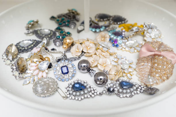 istock Closeup many type of earrings on white tray 1545462158