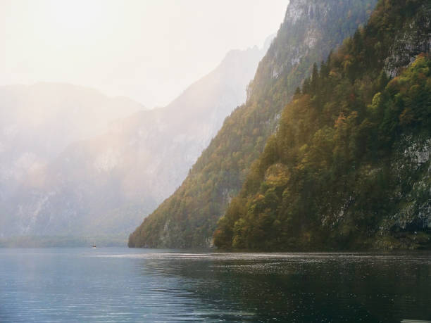 istock Mountain at the lake with sunlight flare 1545495047
