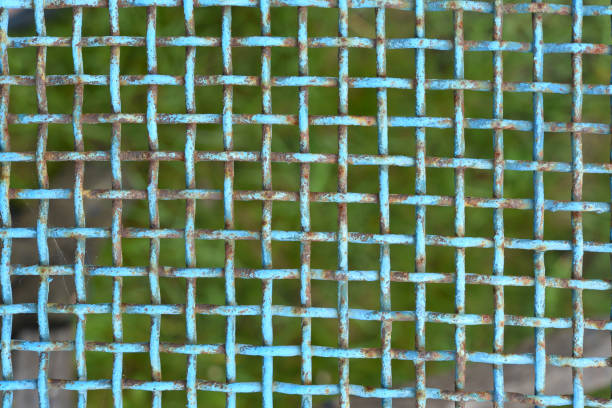 istock Iron painted mesh. Blue metal mesh close-up. iron fence. 1545498264