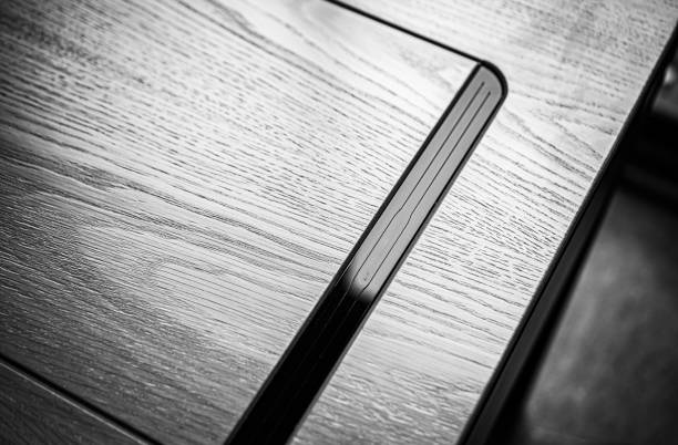 istock Empty rough wooden table top in the dark room 1545503646